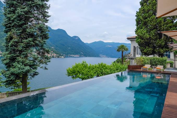 Infinity pool at Villa Lario overlooking Lake Como and the surrounding mountains.
