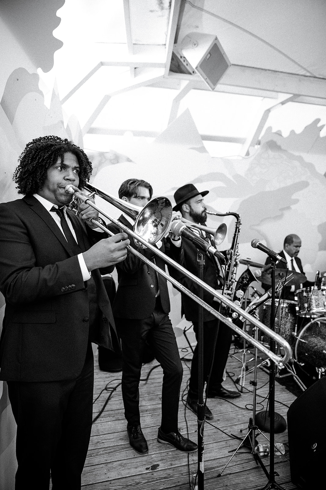 The horn section of The Best Wedding Band mid-performance