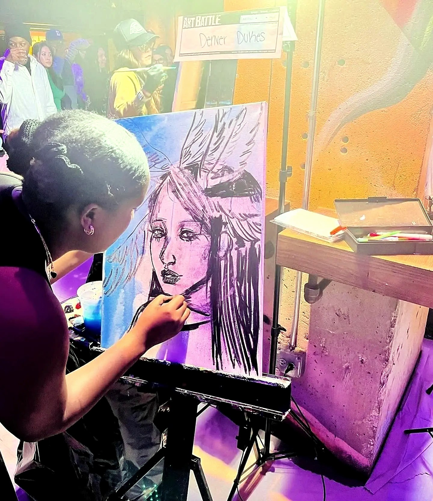Denver Dukes painting a canvas live before an audience at an Art Battle event — Imagine If Foundation, Gordon Dukes Music Company